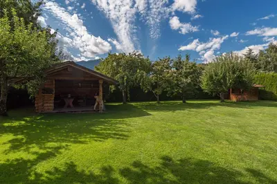 a small cabin in a field of green grass at Kienasthof in Bressanone