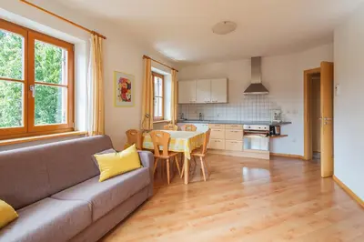 a living room with a couch and a table at Kienasthof in Bressanone