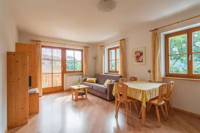 a room with a kitchen and a living room at Kienasthof in Bressanone