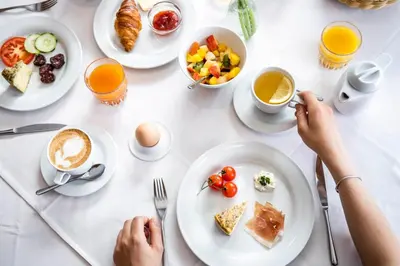 a table full of breakfast foods and drinks at Familienhotel Viktoria in Ultimo