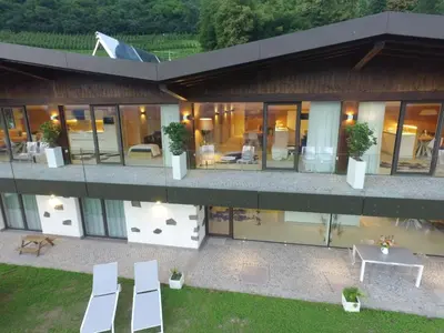 an aerial view of a house with white chairs at Moar Lodge in Postal