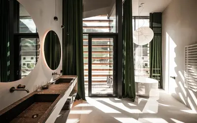 a bathroom with a sink and a mirror at Hotel Jaufentalerhof in Racines