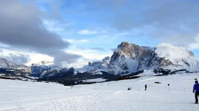 a group of people skiing down a snow covered mountain at Residence Perwanger in Fiè
