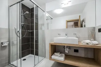 a bathroom with a shower and a sink at Residence Crazzolara in La Villa