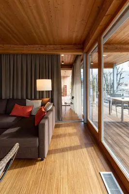 a living room with a couch and a table at Kronplatz LOFT Bruneck in Brunico