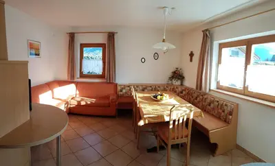 a living room with a couch and a table at Appartements Oberleiter in Valdaora