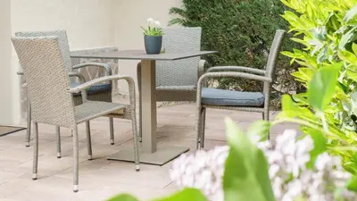 a table and four chairs sitting around a table at Pension Sunnhofer in Vilpiano