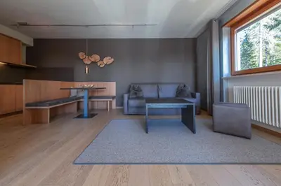 an empty hallway with a door leading to a bedroom at Josef Mountain Resort in Avelengo