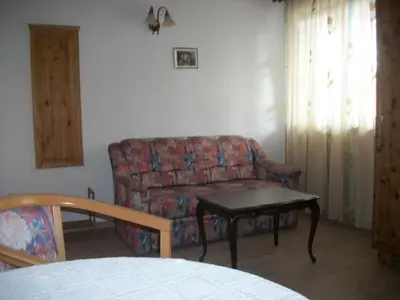 a living room with a couch and a table at Agri-park Casa Miramonte in Ronzone