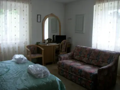a living room with a couch and a chair at Agri-park Casa Miramonte in Ronzone