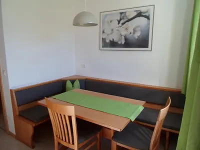 a dining room with a table and chairs at Stockerhof in San Lorenzo di Sebato
