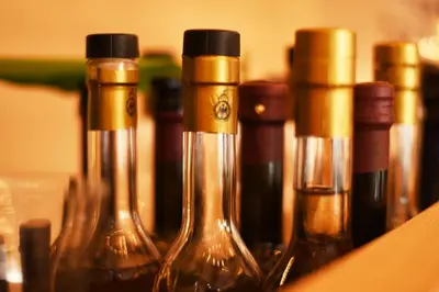 a group of wine bottles sitting on a shelf at Das Alte Rathaus in Egna