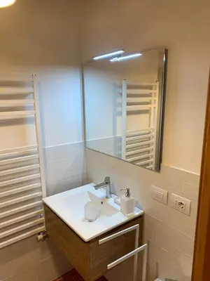 a bathroom with a sink and a mirror at Casa Italo in Canazei