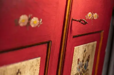 a red door with flowers on it at Gabriel in Ortisei