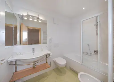 a bathroom with a sink and a toilet and a shower at Gabriel in Ortisei