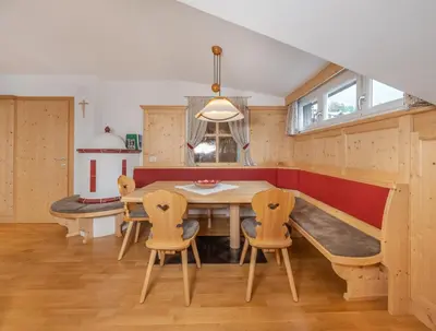 a dining room with a table and chairs at Gabriel in Ortisei