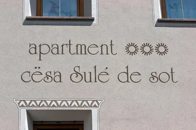 a sign on a building that says apartment csa suite be set at Cesa Sule de Sot in Ortisei