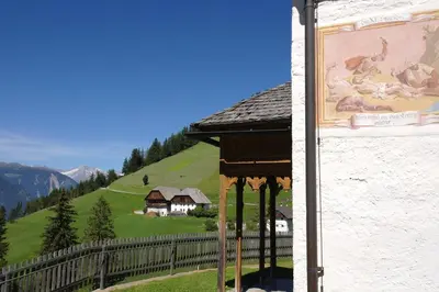 a painting of animals on the side of a building at Naturhotel Miraval in Perca