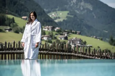 a view from the lobby of a resort with benches at Alpenheim Charming & Spa Hotel in Ortisei