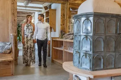 a bride and groom standing in a room with a table at Miraval Hotel in Coredo