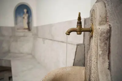 a water faucet in a bathroom with a sink at Hotel Clara in Bressanone