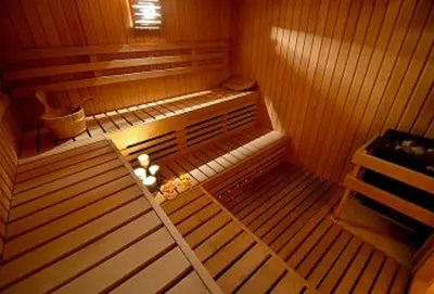 an empty sauna with twothirds of the roomyss at Hotel Nigritella in Selva di Cadore