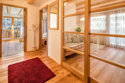 a house with a balcony on the side of it at Spanglerhaus in Nova Ponente