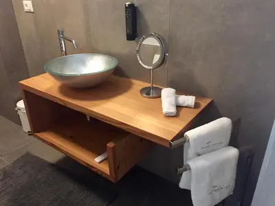 a bathroom with a bowl sink and a mirror at M-Loft merangardenvilla in Merano