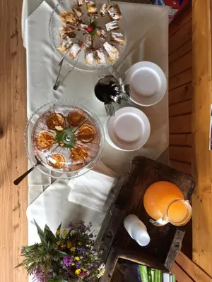 a table with plates of food on top of it at Hotel Alla Rocca in Varena