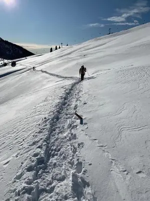 a person skiing down a snow covered slope at Hotel Alla Rocca in Varena