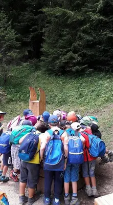 a group of people with backpacks standing in a line at Family Hotel Gran Baita in Pozza di Fassa