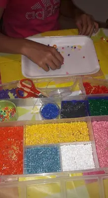a table filled with lots of different colored legos at Family Hotel Gran Baita in Pozza di Fassa