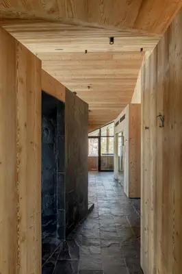 a house under construction with a wooden ceiling at HOTEL de LEN in Cortina dʼAmpezzo