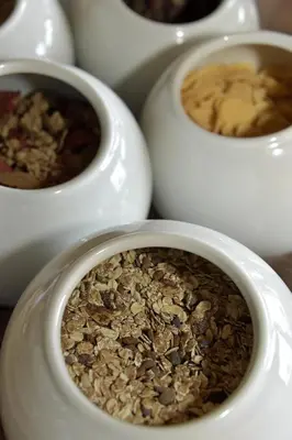 a group of white bowls with nuts in them at Hotel Walder in Schenna