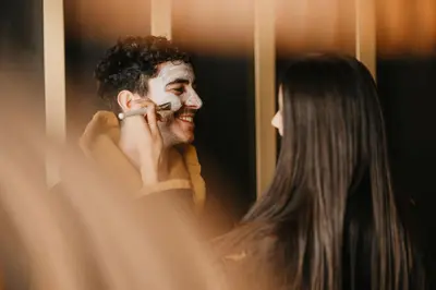 a woman looking at a man talking on the phone at Alpin Garden Luxury Maison & SPA - Adults Retreat in Ortisei