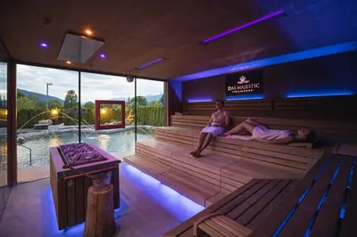 a salon with chairs and a waiting room at Majestic - Unique Spa Resort in Brunico