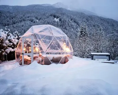 a igloo in the snow in the mountains at Olympic SPA Hotel - Adults Only in Vigo di Fassa