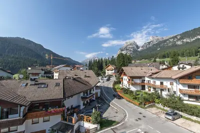 a view of a village in the mountains at Apartments Ciasa Costa in Badia
