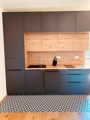 a kitchen with a sink and a counter at Julias Guesthouse in Ora/Auer