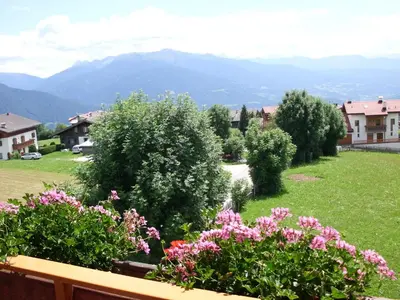 a view from the balcony of a house with flowers at Rosenheim in Maranza