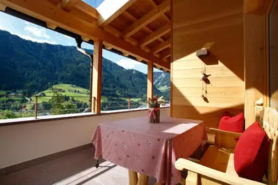 a table in a room with a view of a mountain at Apartments Victoria in Ortisei