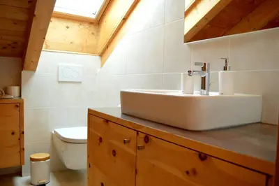 a bathroom with a sink and a toilet at Hintnerhof in Chiusa