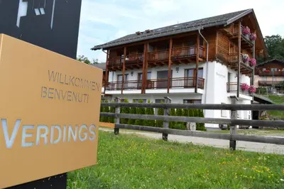 a building with a sign in front of it at Hintnerhof in Chiusa