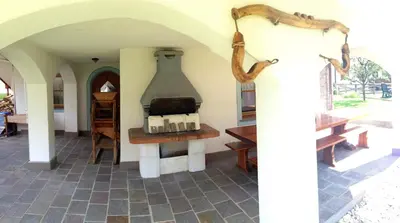 a room with a large vase hanging from the wall at Casa Guido e Laura in Pozza di Fassa