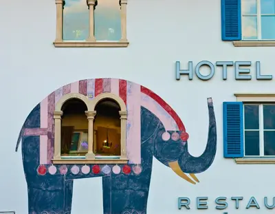 an elephant painted on the side of a hotel at Hotel Elefant in Ora/Auer