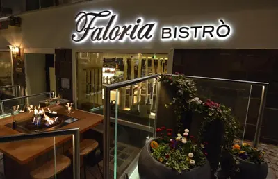 a restaurant with a sign that reads talalo bistro at Hotel Faloria in Moena