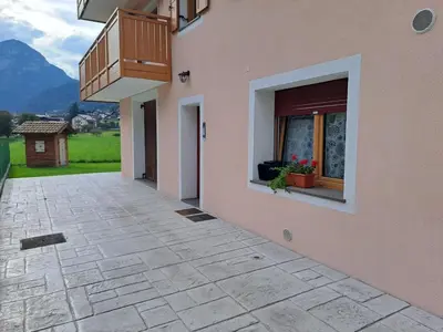 an empty courtyard of a house with a balcony at Casa Vanna in Mezzano