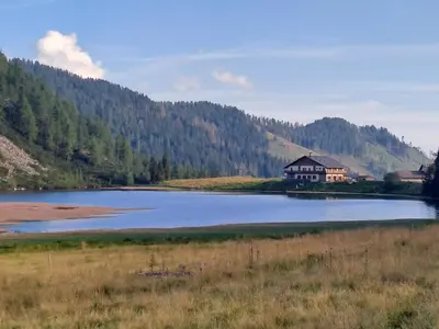 a house sitting on the side of a lake at Casa Vanna in Mezzano