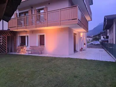 a house with a balcony and a bench in the yard at Casa Vanna in Mezzano