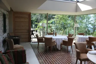a dining room with a table and chairs at Hotel Alle Ciaspole in Fondo